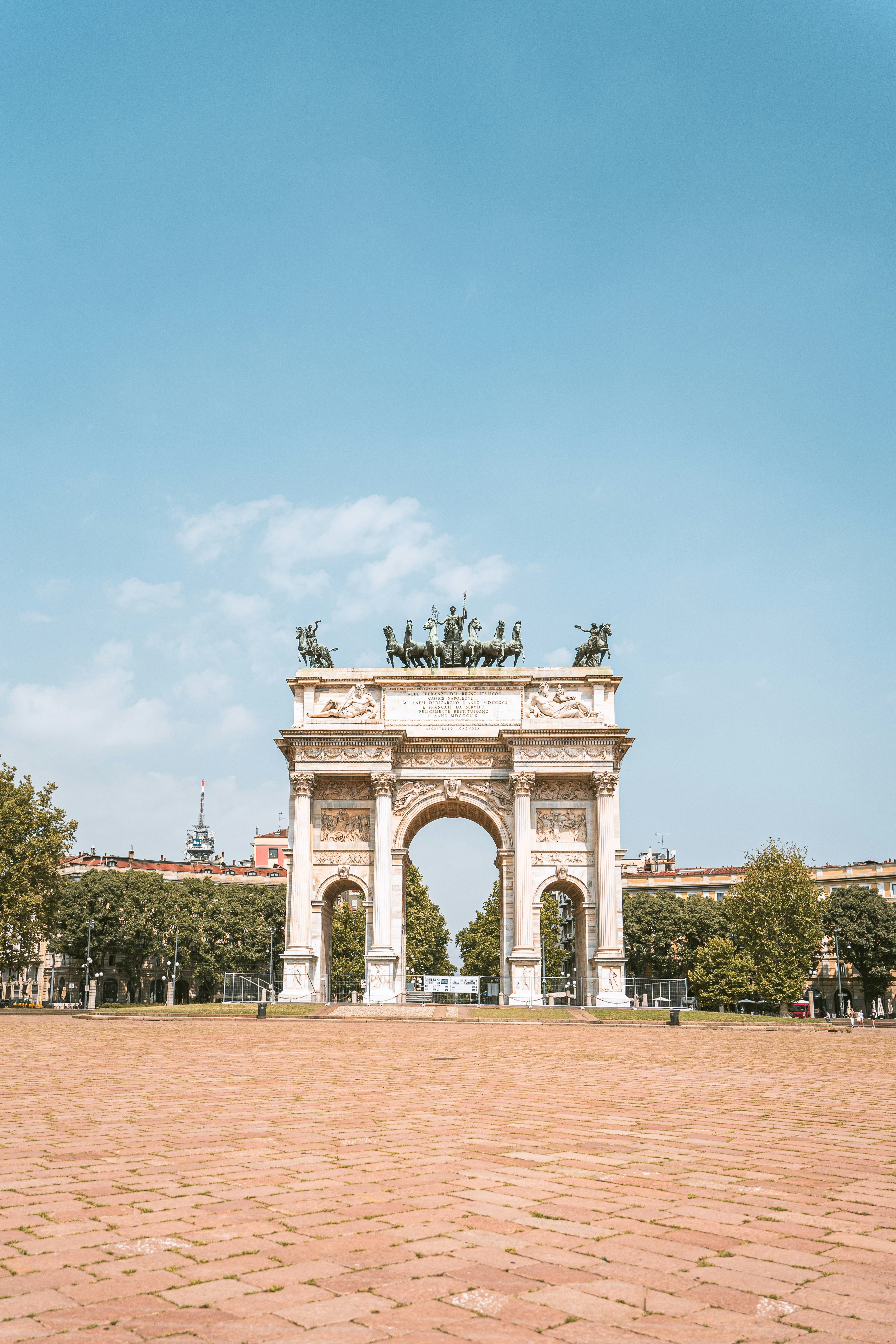 white concrete arch under blue sky during daytime